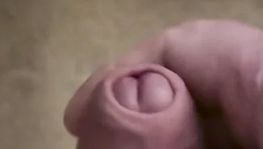 My Friend Sits in a Chair and Jerks off His Cock While Watching Video