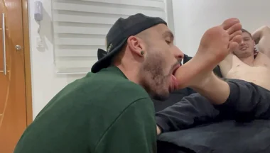 Latino boy licking masters feet
