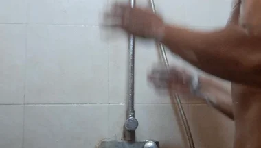 Exotic Skinned Asian Adult Man Taking a Shower in the Morning