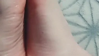Guy Gently Massages His Feet with Oil