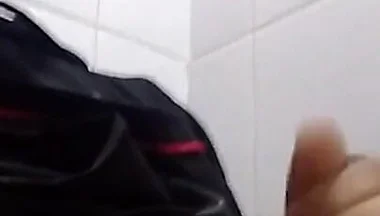 Man Sits in the Bathroom