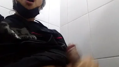 Man Sits in the Bathroom