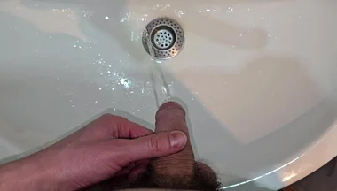 Hairy Cock Peeing Into the Sink in Bathroom with a Strong Stream