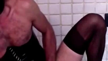 Latex Masked Sissy in Pvc Corset Cums Hard on Stockings and Heels