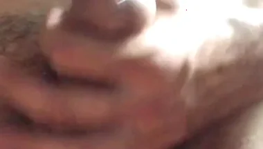 Masturbating