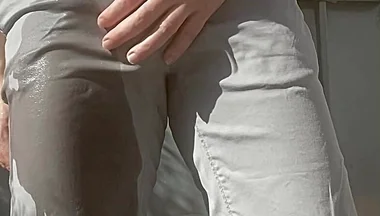 Jules Wets His Grey Pants and Exposes His Semi-hard Cock Through His Trousers