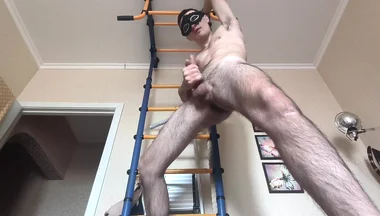 Cock Shaking While Hanging on the Horizontal Bar