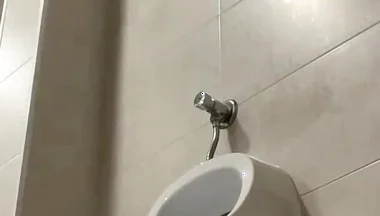Amateur Twink Boy and Older Guy Caught Having Risky Fun in the Pool's Public Toilets