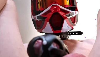 A Puppy Rides a Dildo Wearing a Helmet.