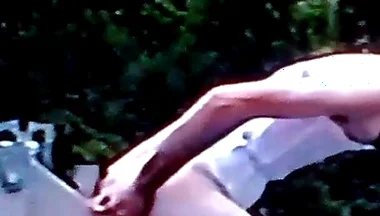 Crossdresser Riding a Giant Dildo on a Roof Top