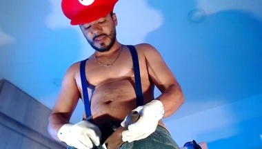 Dressed as Mario Bros Playing with His Plumbing Tool