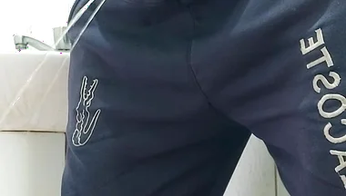 A Well-endowed Brazilian Man Urinating and Showing His Thick Penis to His Female Friends.