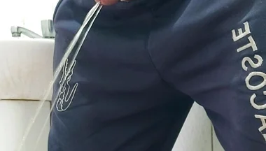 A Well-endowed Brazilian Man Urinating and Showing His Thick Penis to His Female Friends.