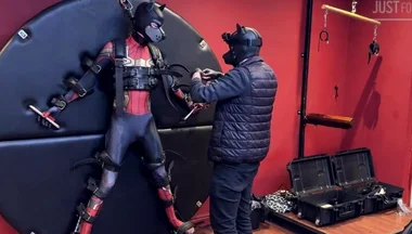 Pup Twink Dressed as Spider-man Strapped to the Bondage Wheel and Milked