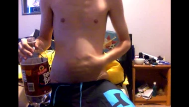 Young Guy Fills His Stomach with Water