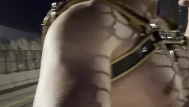 Midnight Muscle Tease: Asian Hunk Flexes Ass & Biceps in Yellow Harness on Highway Bridge