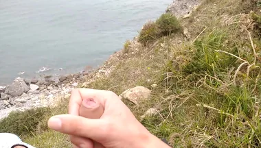 Big Beautiful Big Fat Cock Gets Handjob on the Beach with Gorgeous Sea Views