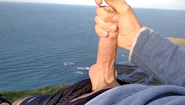 Huge Dirty Cock Gets Handjob on the Beach and Squirts a Lot of Thick Sperm in Front of the Beach