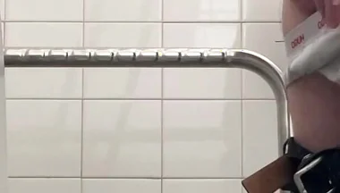 In the Hospital Toilets, a Guy Pisses Into a Cup for a Urine Sample, Then Gets Horny, Jerks-off and Cums