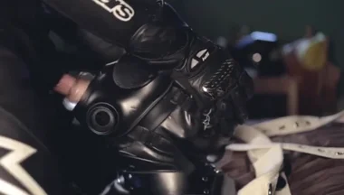 Rubber boy sucking biker master cock