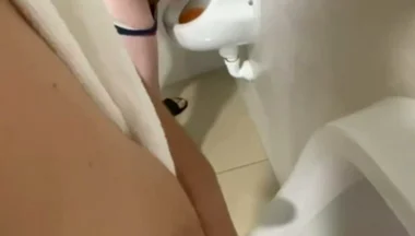 Filming the Guy Peeing Next to Me at the Urinal of the Pool Toilets