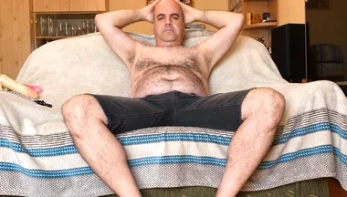 Zolee does a striptease and plays with himself