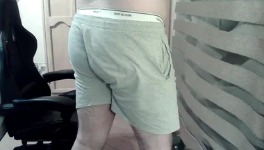 Muscular Camboy Flexes His Muscles and Squats