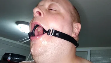 Deepthroating a 7 Inch Dildo with Mouth Gag Ring