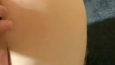 A Crossdresser in Leggings and a Seductive Bodysuit Plays with Ass