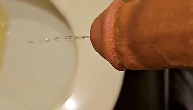 Shaved Cock Pissing