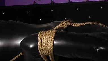 Roped in Latex: Zeus Struggles to Break Free