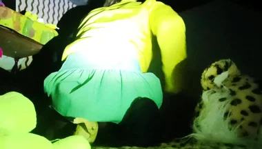 A Young Woman in a Skirt Spreads Her Buttocks Wide.