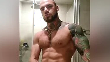 Bold Tattooed Jock Flexing In Bathroom And Jerking Massive Cock
