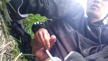Gay boy Jon Arteen, wearing adidas tracksuit Campus sneakers, gets a hard-on outdoors
