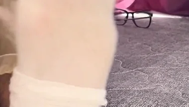 A University Rests Her Feet on Her Face so That the Adorers