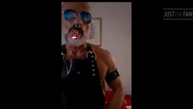 Stepdad lighting his Cigar in rubber apron