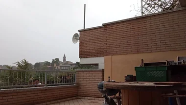 On the Terrace, in the Rain