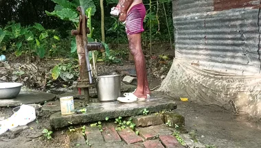 Black mature man bath in desi style. Showing big dick.