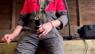 Farmer Smokes and Milks Himself with the Milking Machine